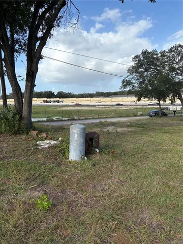 a view of a lake with a yard
