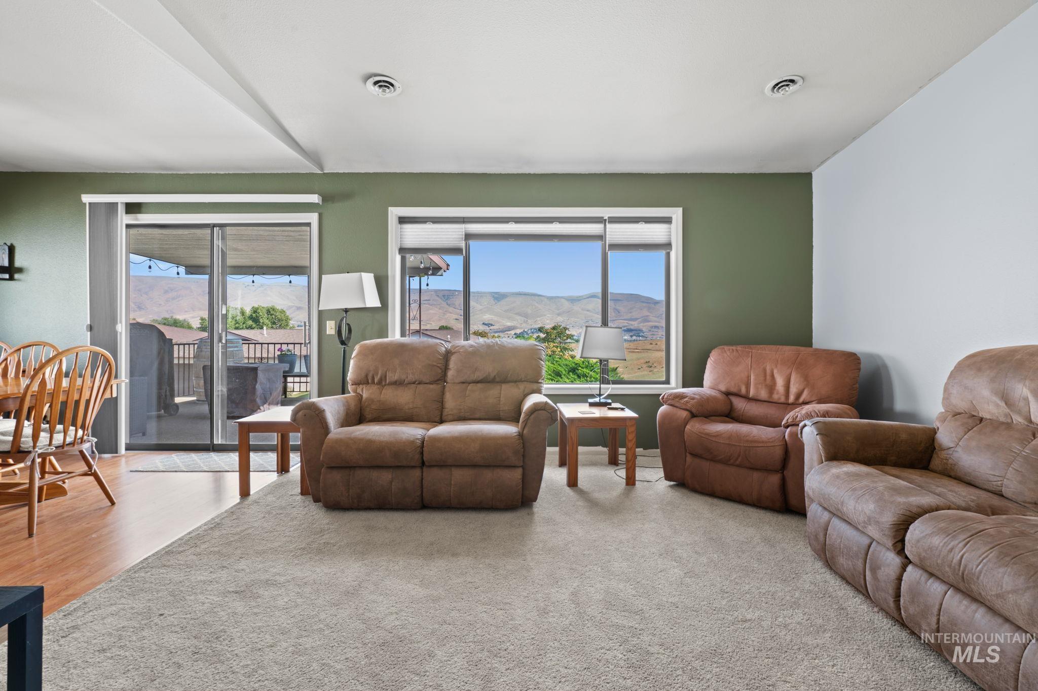 1443 29th Street Lewiston, ID 83501 - Photo 10 of 26 Living room with a mountain view and wood finished floors