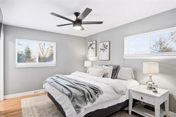 a bedroom with a large bed and a window
