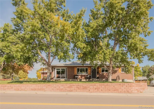 front view of a house with a tree