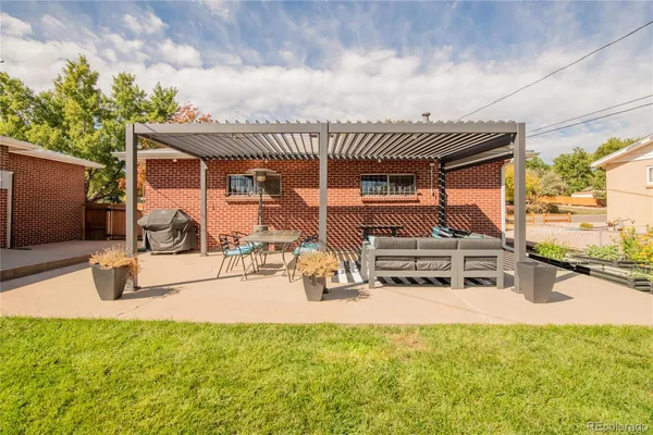 a view of a house with outdoor space and sitting area