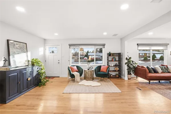 a living room with furniture rug and window