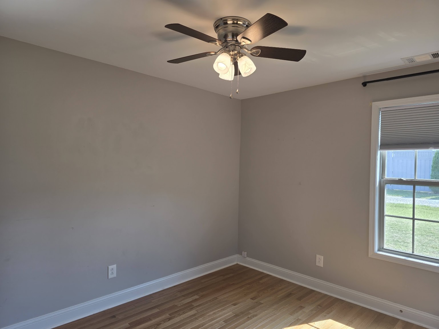 4927 Minnis Road Springfield, TN 37172 - Photo 7 of 15 wooden floor in an empty room with a window