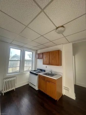 a kitchen with stainless steel appliances granite countertop a sink and a stove