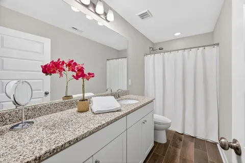 a bedroom with a bed and a table