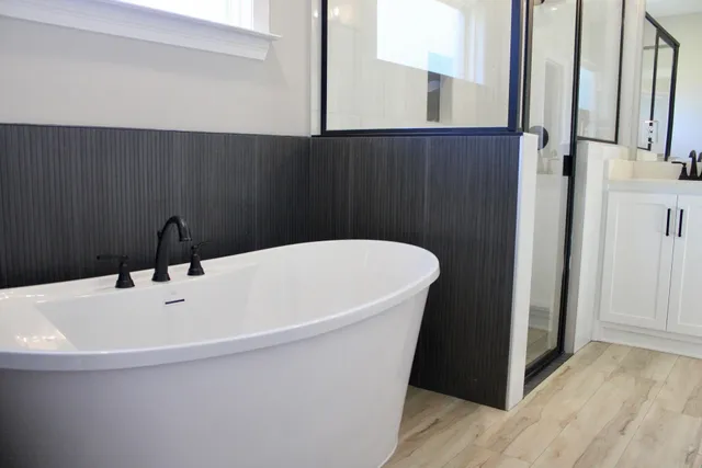 a white bath tub sitting in a bathroom