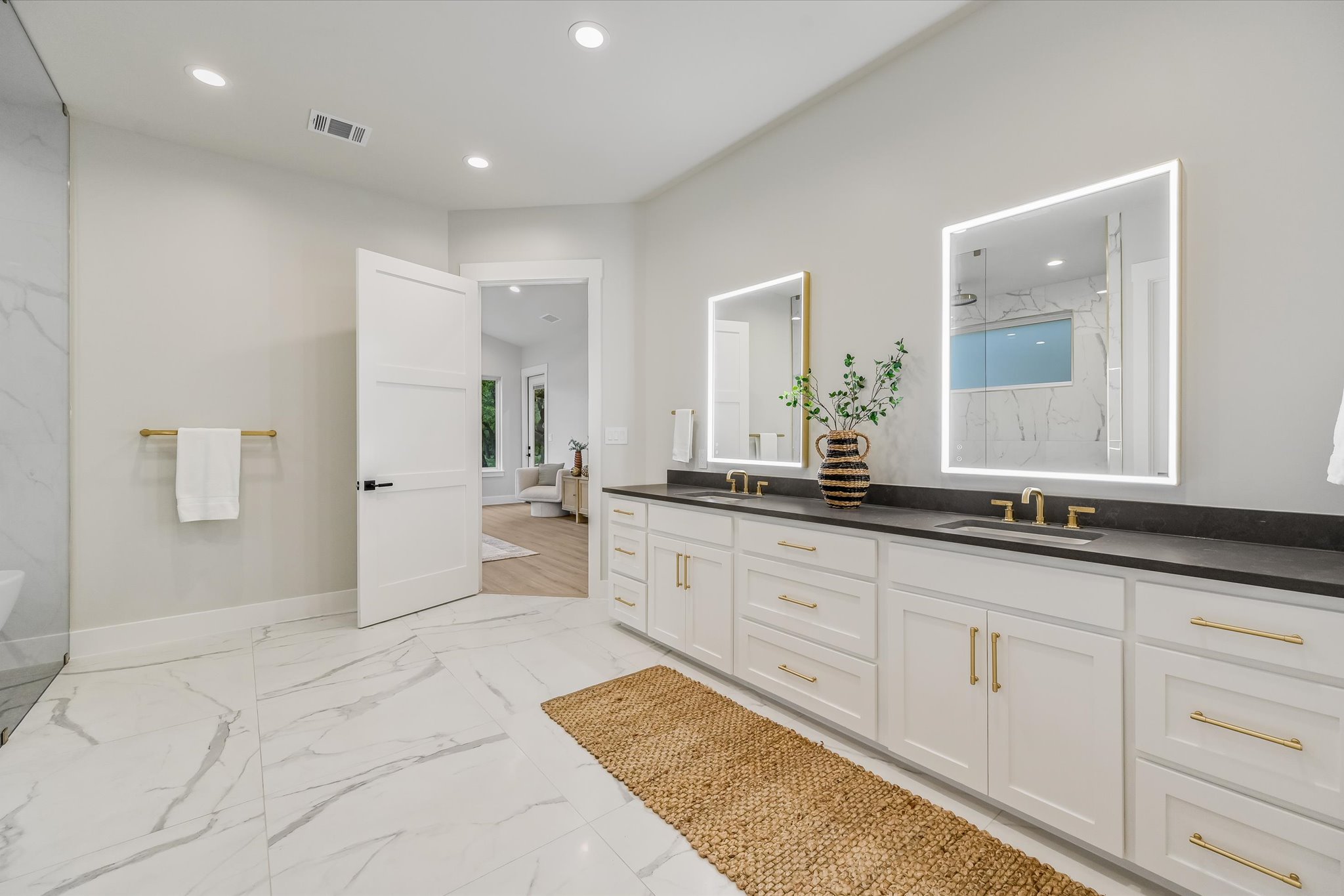 410 Shady Tree Drive Georgetown, TX 78633 - Photo 15 of 40 Full bath with double vanity, recessed lighting, a freestanding bath, a marble finish shower, and light marble finish floors