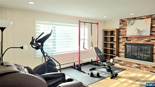 a room with gym equipment and a floor to ceiling window