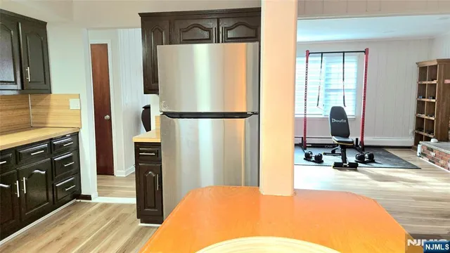 a en suite bathroom with a double vanity sink and a mirror
