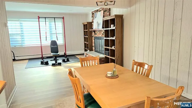 a view of a dining room with furniture and a window