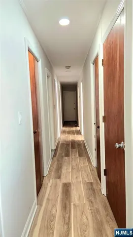 a bedroom with a bed lamp and a window