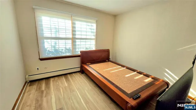a bathroom with a bathtub sink and mirror