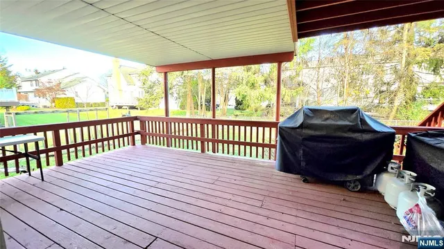 a view of a balcony with wooden floor