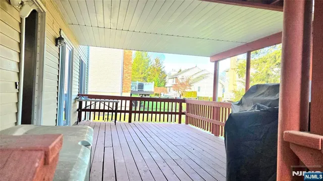 a view of a balcony with wooden floor