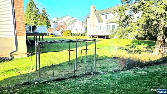 a view of yard with swimming pool