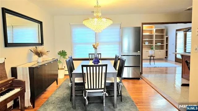 a view of a hallway with furniture and window