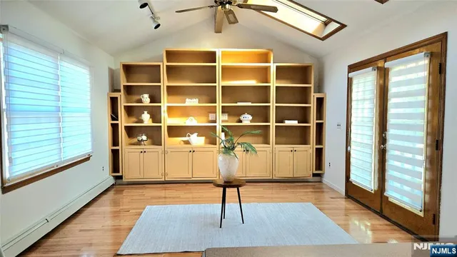 a view of a livingroom with furniture and window