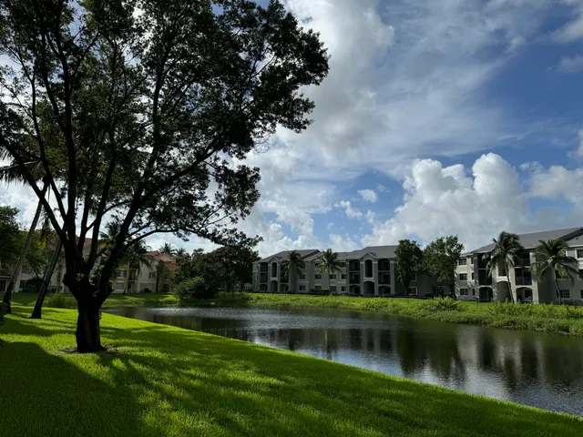 a view of a lake with a building in the background