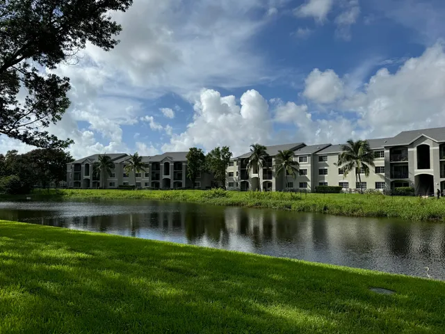 a view of a lake with houses in the background