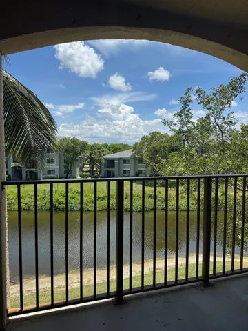 a view of balcony with a forest