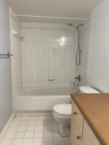 a bathroom with a sink a toilet and a bathtub
