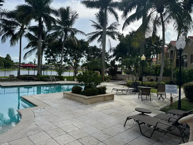 a view of a swimming pool with a table and chairs