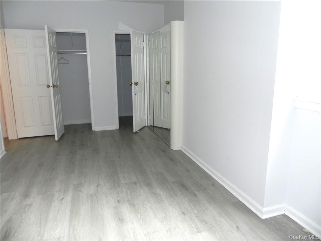 1250 North Avenue, Unit 209 New Rochelle, NY 10804 - Photo 11 of 26 a view of empty room with wooden floor