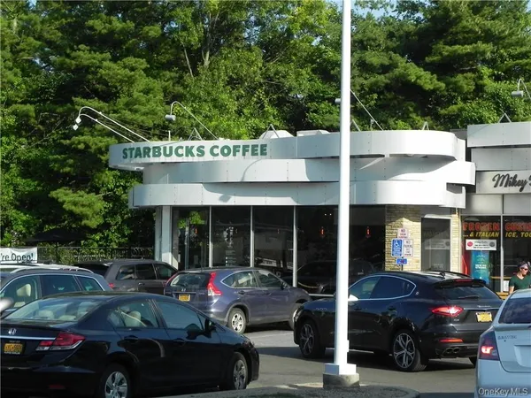 a view of a car park in front of building