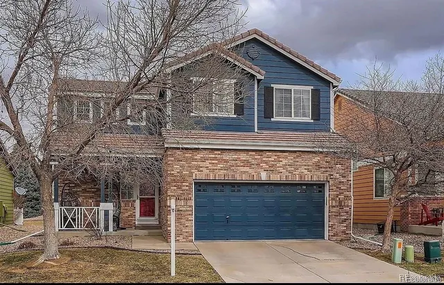 a front view of a house with a garage