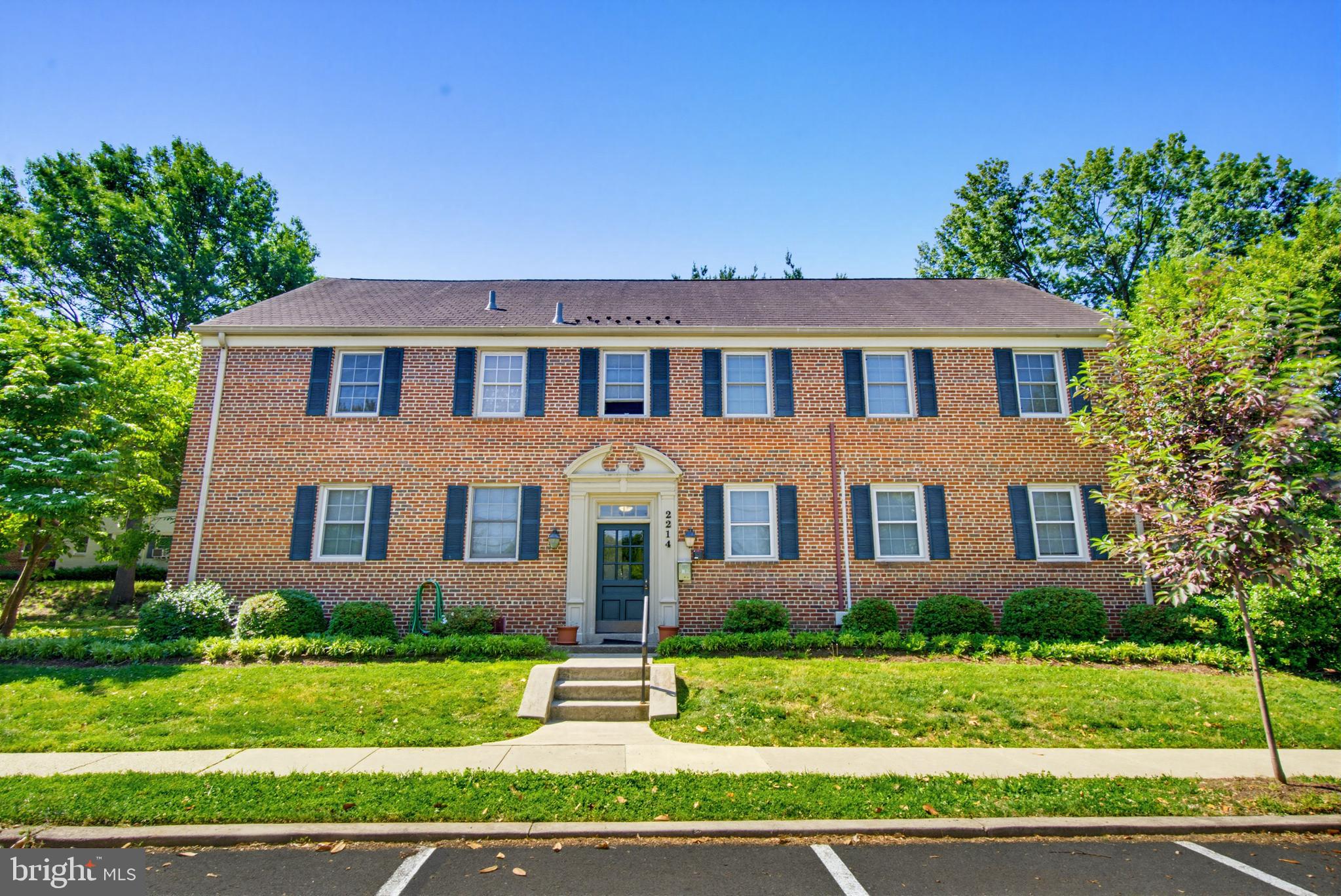 2214 Colston Drive, Unit 201 Silver Spring, MD 20910 - Photo 33 of 43 a front view of a house with a yard