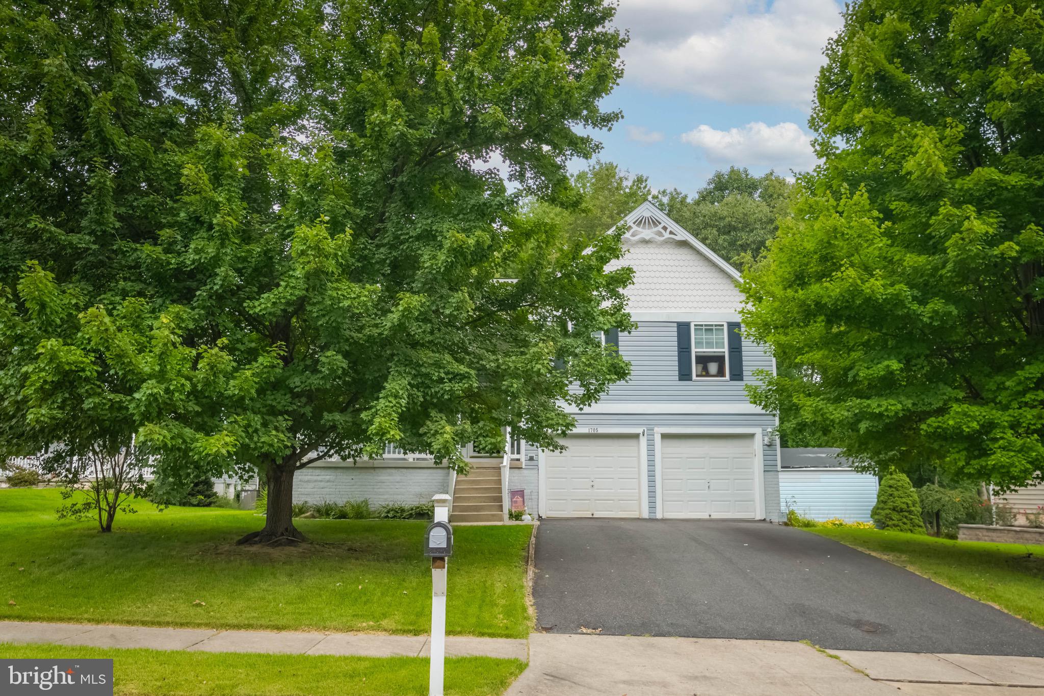 1705 Church Point Court Aberdeen, MD 21001 - Photo 2 of 86 a front view of a house with a garden and trees