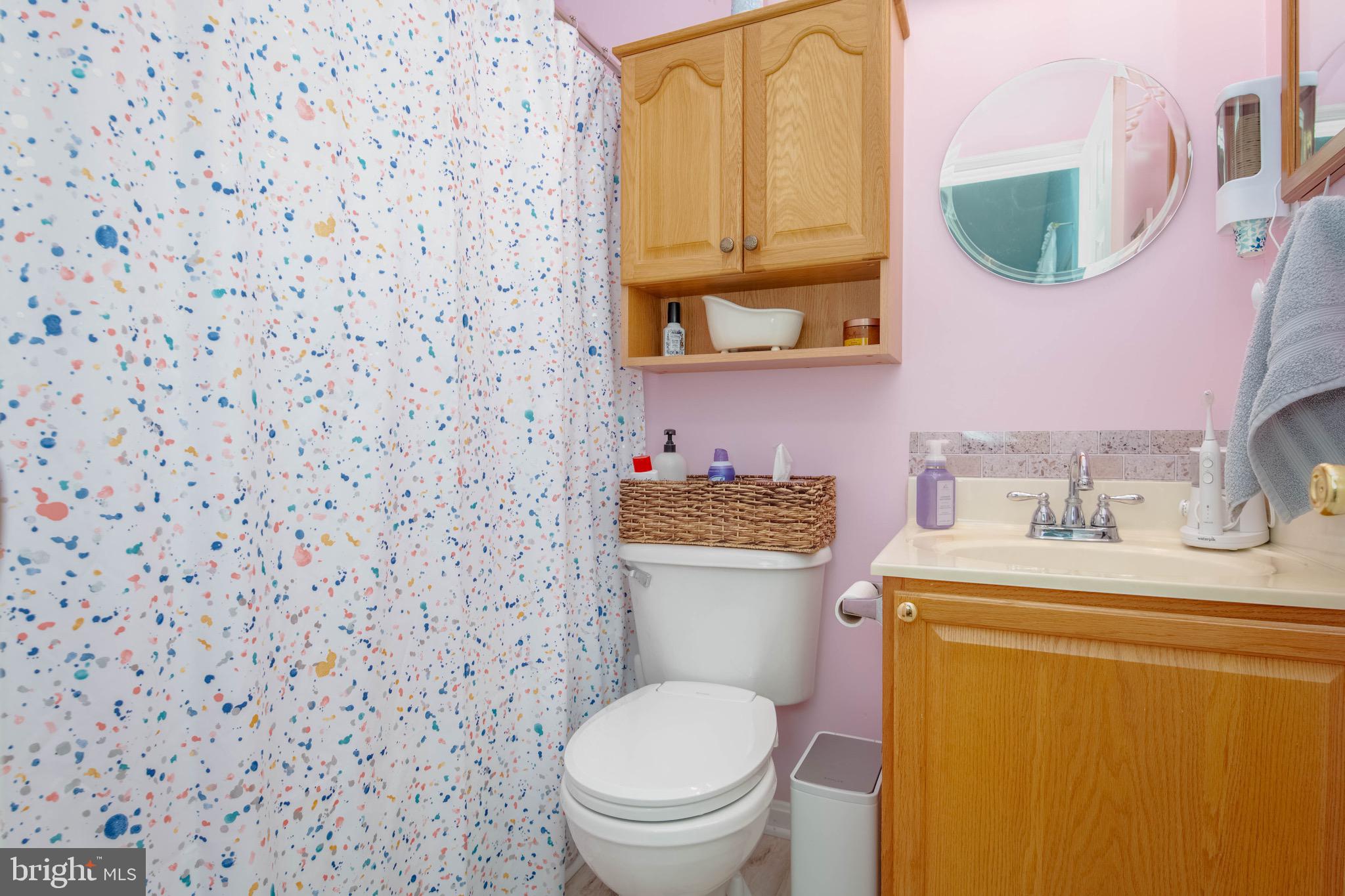 1705 Church Point Court Aberdeen, MD 21001 - Photo 22 of 86 a bathroom with a granite countertop toilet sink and mirror