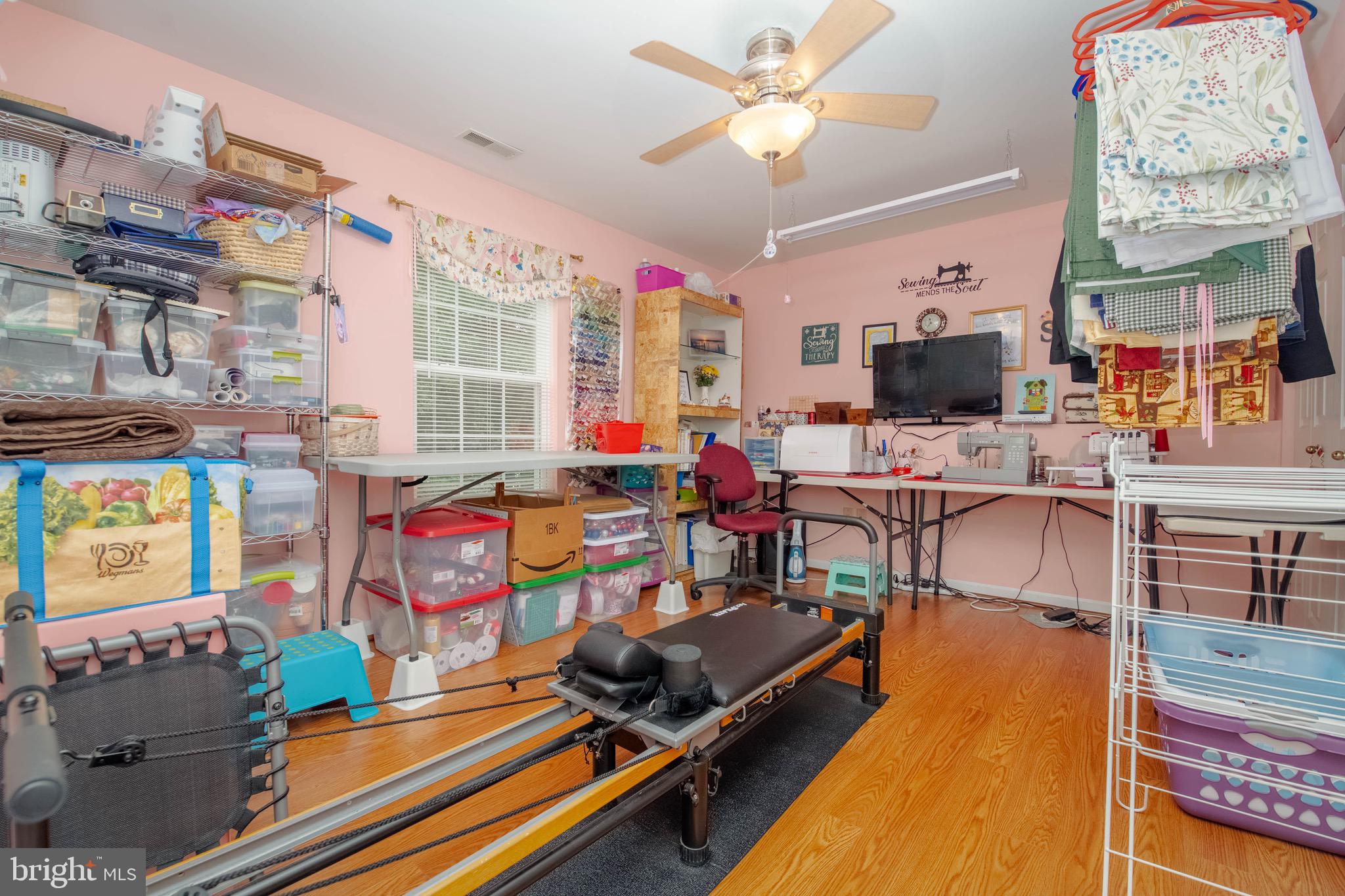 1705 Church Point Court Aberdeen, MD 21001 - Photo 30 of 86 a living room with furniture flat screen tv and a fireplace