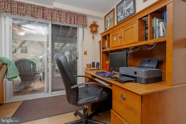 a view of a lake with boats and trees in the background