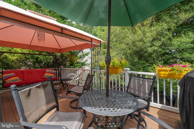 an aerial view of a house with yard swimming pool and outdoor seating
