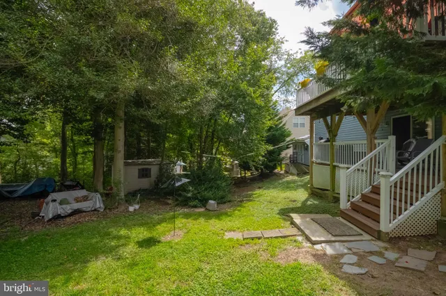 an aerial view of a house with a yard and garden