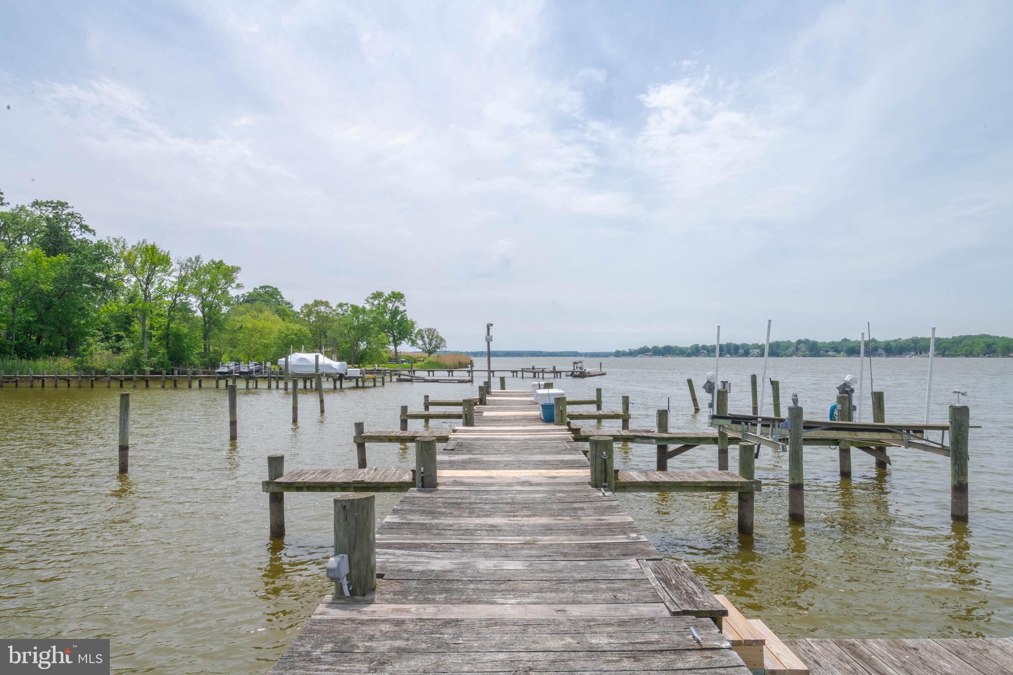 1705 Church Point Court Aberdeen, MD 21001 - Photo 57 of 86 a view of a lake with boats and trees in the background