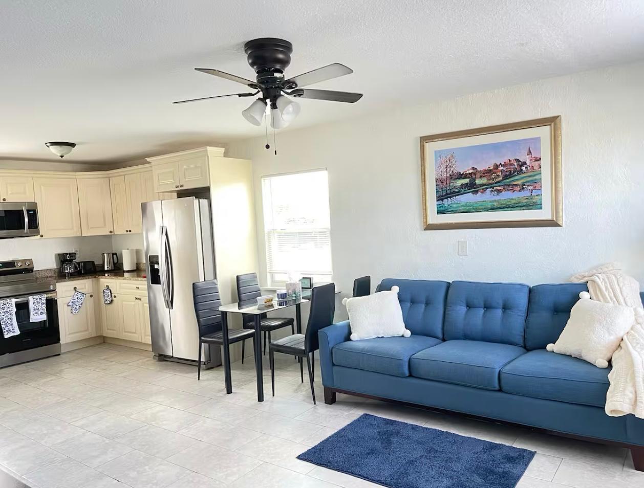 2776 Seminole Road Palm Springs, FL 33406 - Photo 14 of 24 a living room with furniture and kitchen view