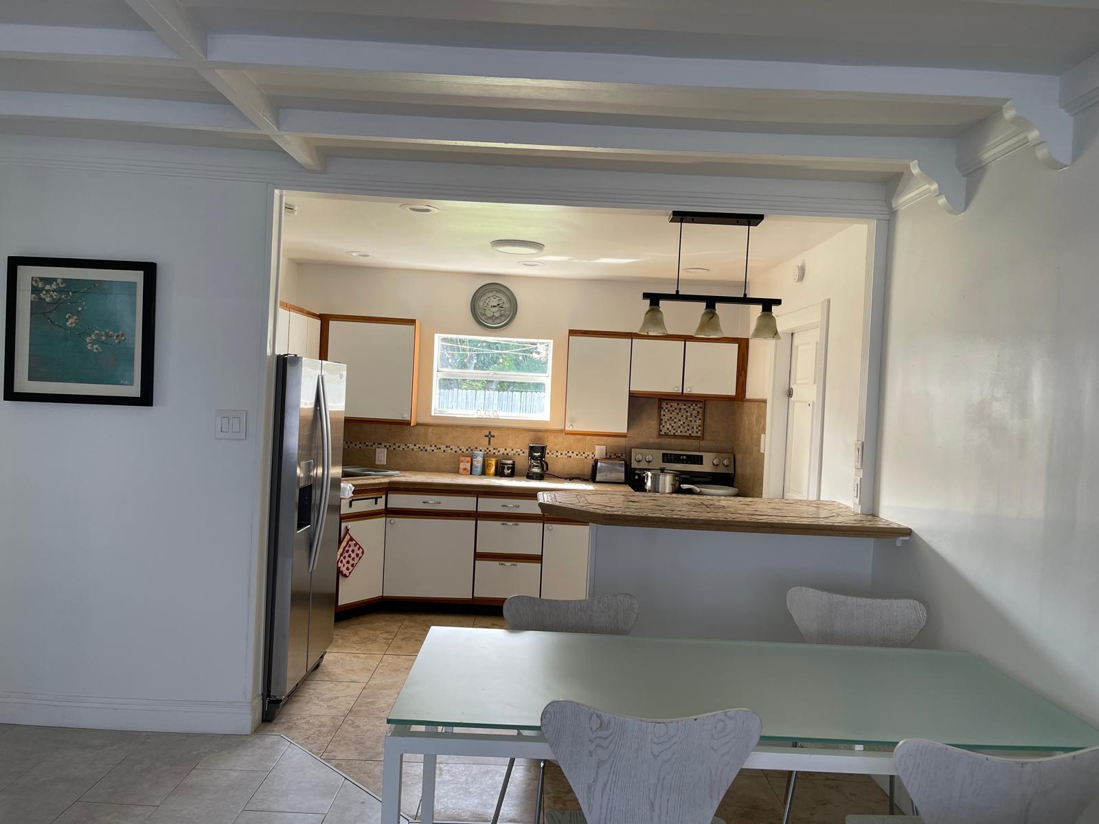 2776 Seminole Road Palm Springs, FL 33406 - Photo 17 of 24 a kitchen with stainless steel appliances a stove and more cabinets