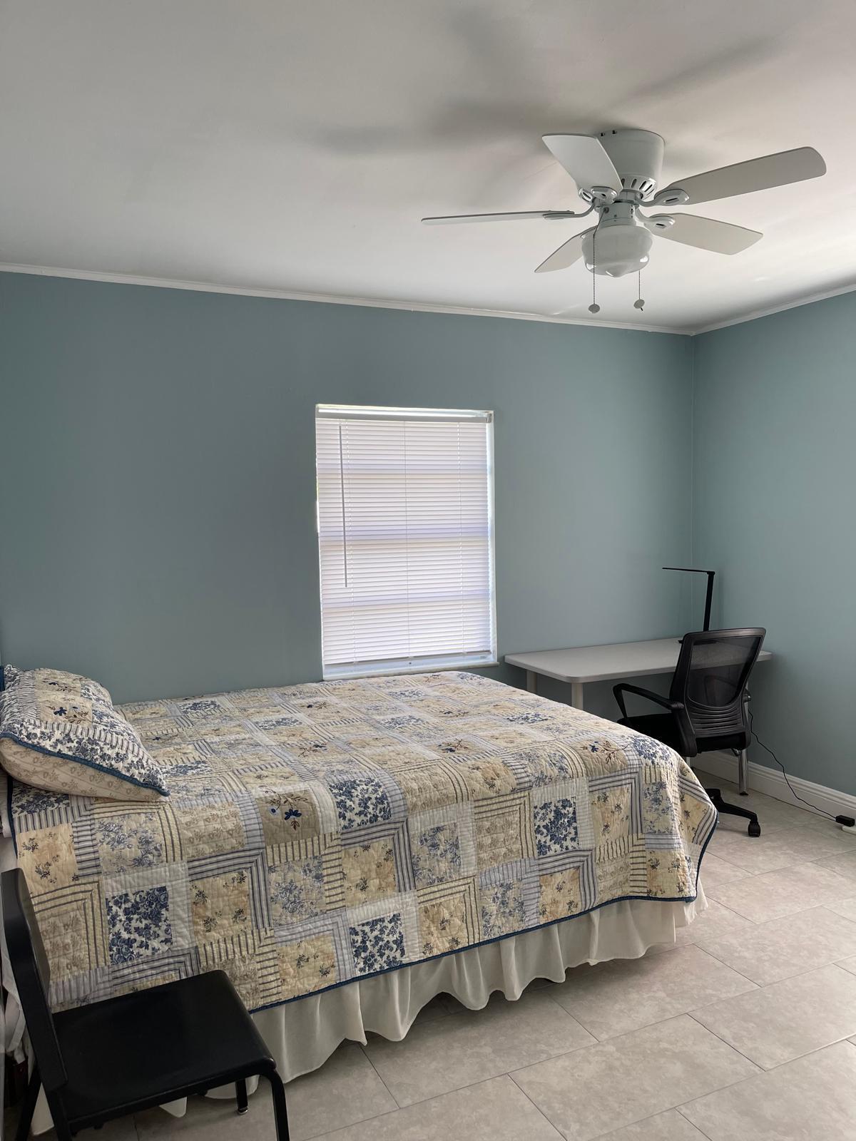 2776 Seminole Road Palm Springs, FL 33406 - Photo 19 of 24 a bedroom with a bed and a dresser