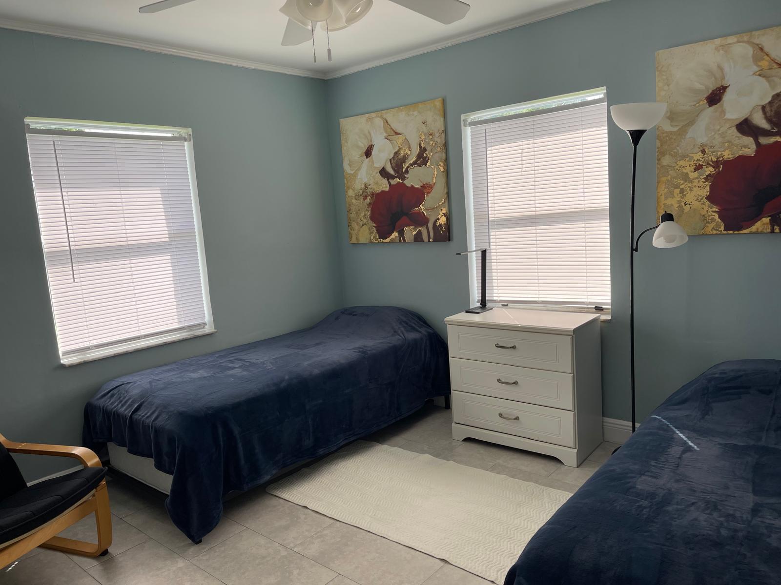 2776 Seminole Road Palm Springs, FL 33406 - Photo 20 of 24 a bedroom with a bed and window
