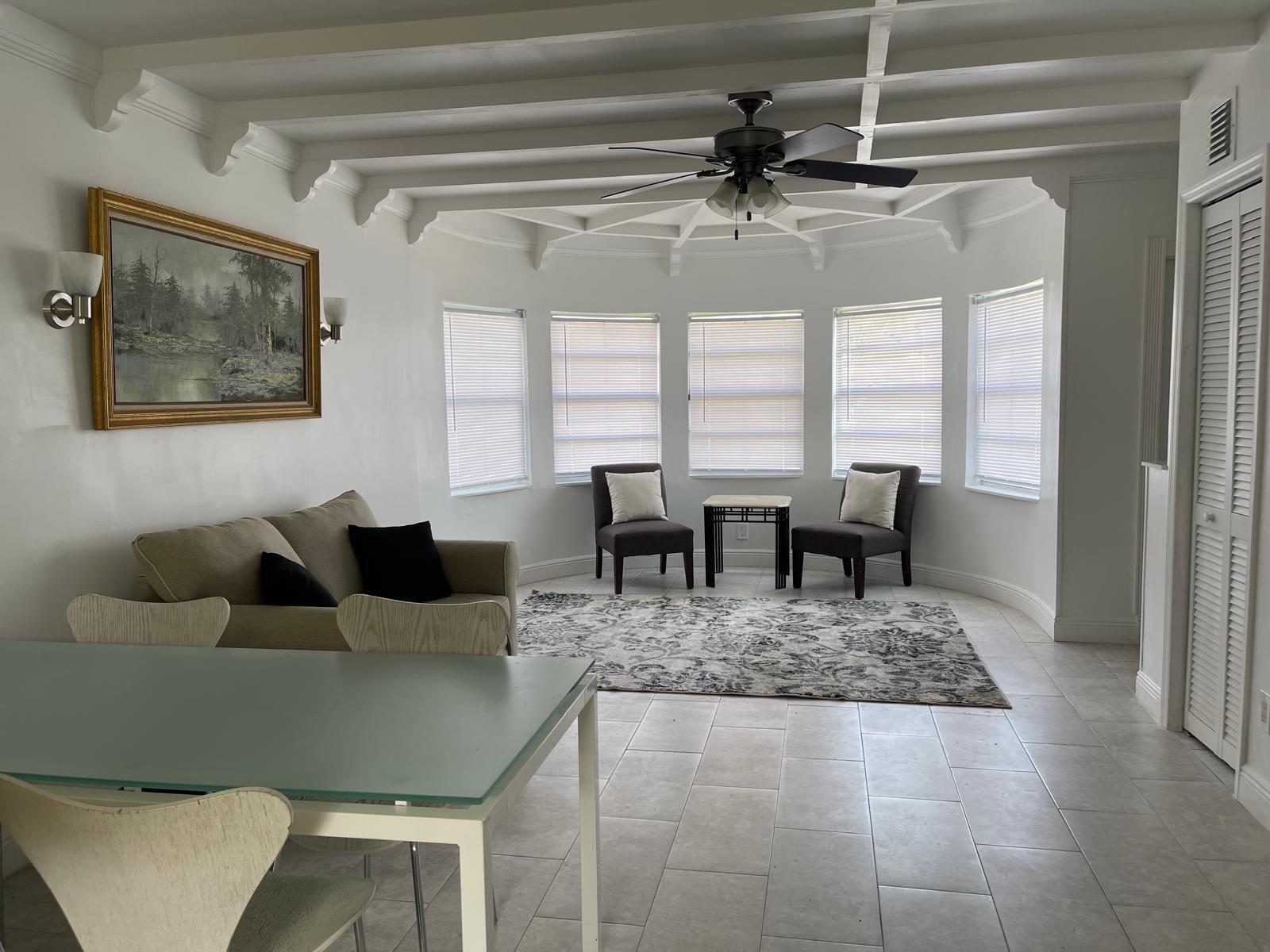 2776 Seminole Road Palm Springs, FL 33406 - Photo 24 of 24 a view of a dining room with furniture and window