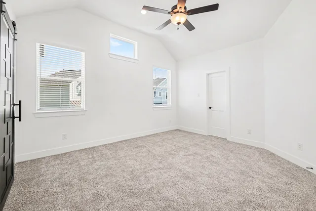 a bedroom with bed and a window