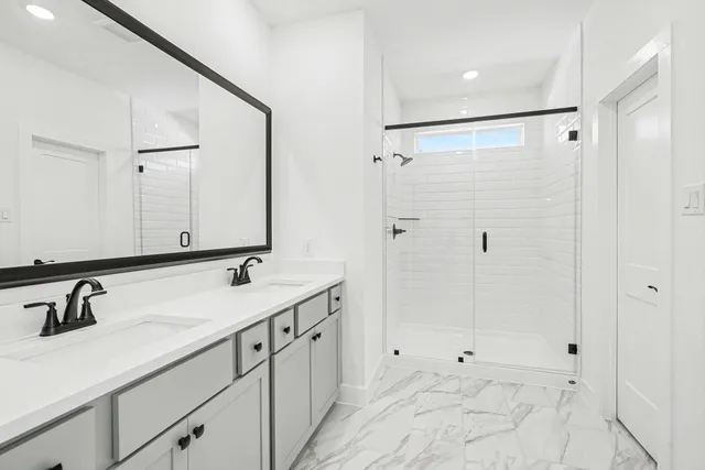 an empty room with closet and windows