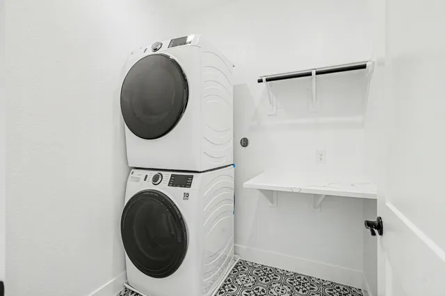 a bathroom with a shower sink and mirror