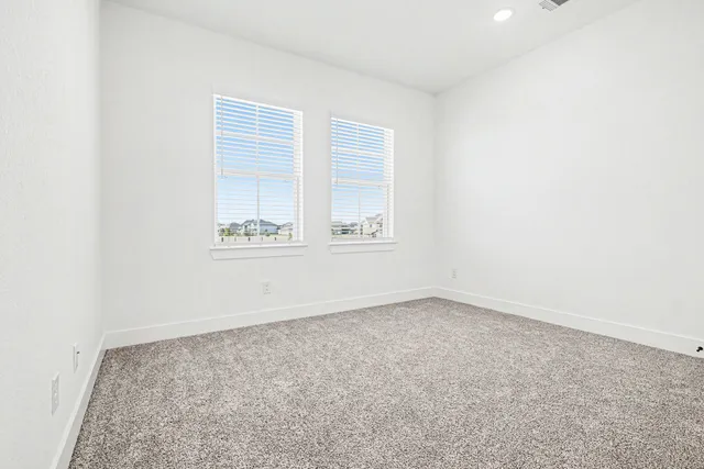 a bathroom with a sink a toilet and shower a mirror