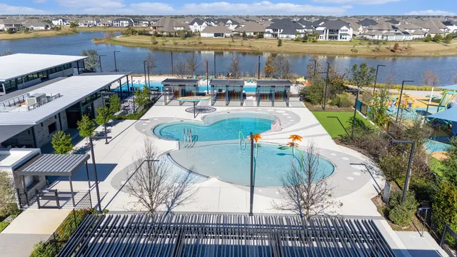 a view of a swimming pool with a lounge chairs