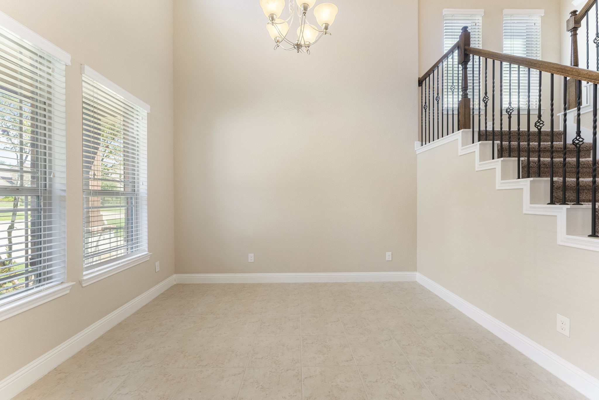 3565 Falcon Way Conroe, TX 77304 - Photo 8 of 50 Alternate dining-area view highlighting the staircase and open layout.