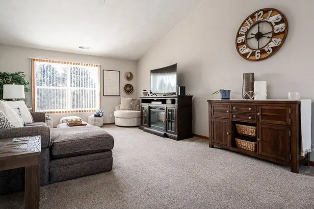 a kitchen with stainless steel appliances granite countertop a refrigerator stove top oven and sink