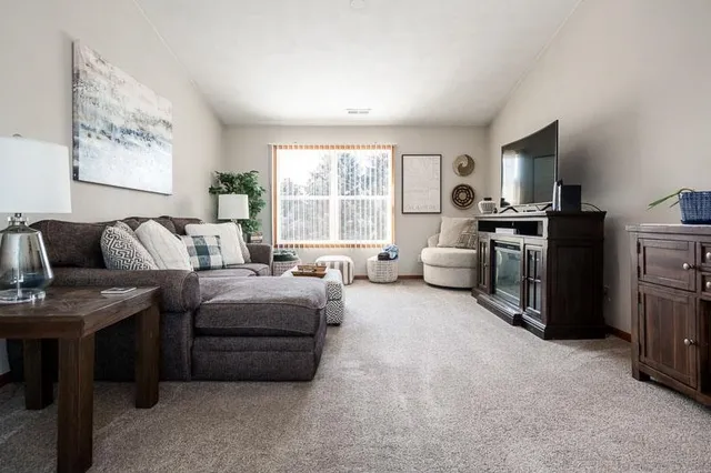 a kitchen with stainless steel appliances granite countertop a stove top oven a refrigerator and a granite counter tops